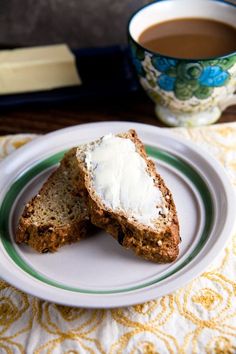 two pieces of bread on a plate with butter