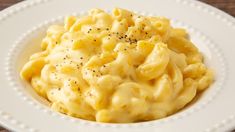 macaroni and cheese is served on a white plate