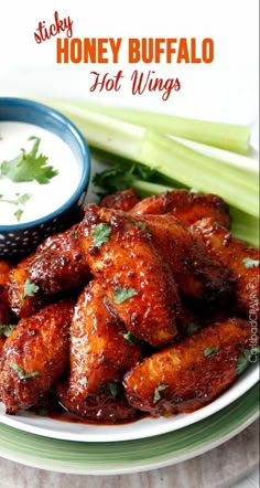 honey buffalo hot wings on a plate with celery and ranch dressing in the background