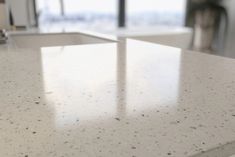 a counter top in a kitchen next to a window