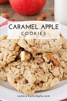 an apple and oatmeal cookie on a white plate with apples in the background