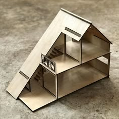 a paper model of a house on the ground