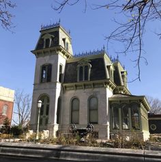 an old victorian style house on a sunny day