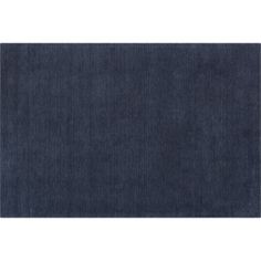 an area rug with dark blue denim fabric on the bottom, and a white background