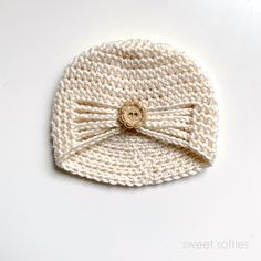 a crocheted hat with a bow on it