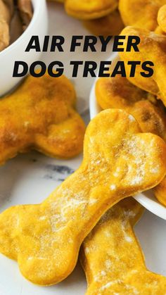 small dog treats are on plates next to a bowl of peanut butter and chocolate chips