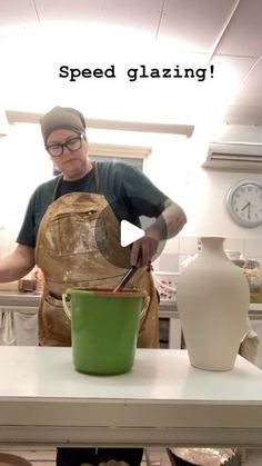 a man in an apron is making something with clay on a table and the words speed glazing above him