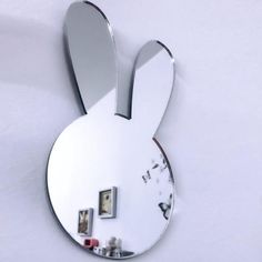 the mirror is shaped like a rabbit's head