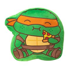 a green pillow with an image of a turtle eating a slice of pizza on it