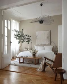 an instagram photo of a bedroom with white bedding