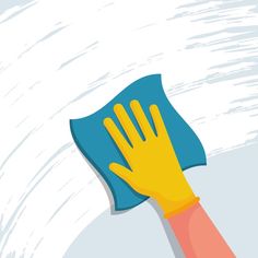 a person with yellow gloves is holding a blue duster in their hand on a white background