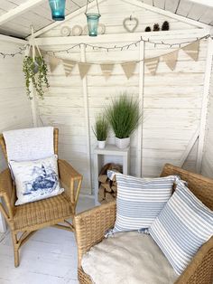 two wicker chairs sitting next to each other on top of a white wooden floor