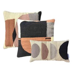 three pillows with different shapes and colors