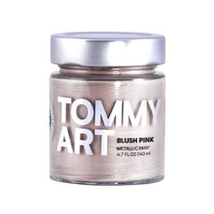 a jar of pink metallic paint with the words tommy art on it's lid