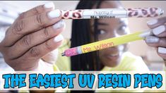 a woman holding two pencils with the words, the fastest u - resin pen