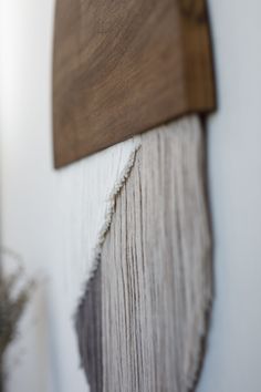 a piece of wood is hanging on the wall