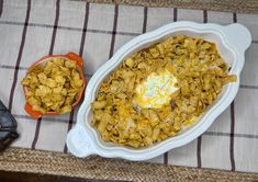 a casserole dish with cornflakes and an orange bowl