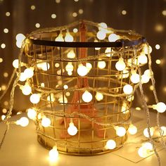 a basket filled with white lights on top of a table