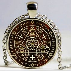 a pendant with an image of the seven deadly symbols on it, in front of a white background