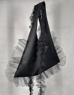 Heavy Weight But Soft Touching Bag Handcrafted In The A Shape. Edgy Ruffled Tulle Outline Provides A Blossoming Look. The Shoulder Embellishments Are Made With Ruffled Metallic Lace And Fine Grained Tulle Strips For Your Creative Freedom In This Flourish Mystery Black Tote. Exclusive Runway Twill-Wool Metallic Lace & Fine Tulle Strips Embellishments On Both Handles Approx 33”H X 30”W , Pocket Depth 14” Model Height 5’6’’Handcrafted In USAGarment Care- Dry clean recommended - Hand wash up to 30°- Cool Bag Design, Ruffles Bag, Lace Bag, Diy Bag Designs, Creative Freedom, Metal Lace, Handmade Lace, Handmade Bag, Black Tote