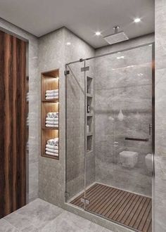 a bathroom with a walk in shower next to a toilet and wooden shelves on the wall