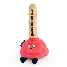 a red stuffed animal with a wooden stick sticking out of it's back end