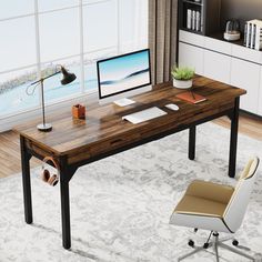 an office desk with a computer on it and a chair next to it in front of a window