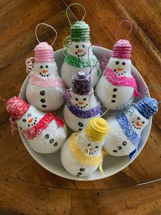 snowman ornament ornaments in a bowl on a table