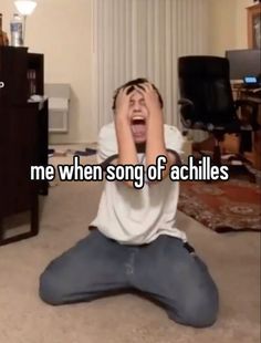 a man sitting on the floor with his hands in his face and text that reads, me when song of achies