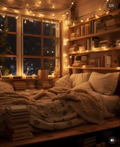 an unmade bed with books and lights on the windowsill in front of it