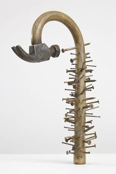 an odd looking metal object with spikes attached to it's back end, against a white background