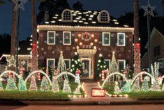 a large house covered in christmas lights and decorations