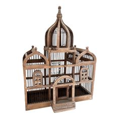 a wooden bird cage with two birds inside