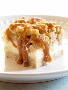 a piece of cake with caramel topping on a plate