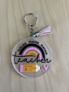 a keychain with the words teacher written on it