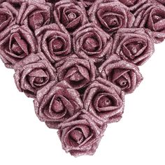 an arrangement of pink roses arranged in the shape of a heart on a white background