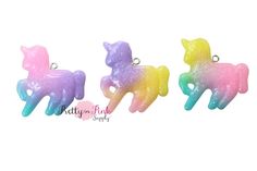 three different colors of unicorn charms on a white background with the words, baby pink and purple