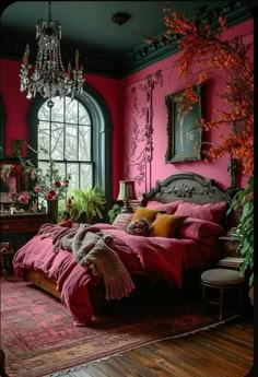 a bedroom with pink walls and wooden flooring, chandelier hanging from the ceiling