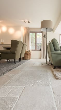 a living room filled with furniture and a lamp