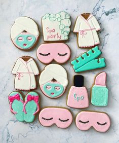 decorated cookies are arranged in the shape of women's clothing and shoes, with words on them