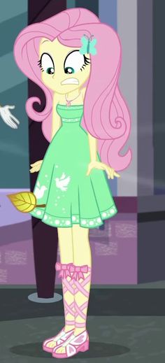 the pinkie is standing in front of a mirror with her hands on her hips