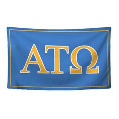 a blue and yellow flag with the letters atq on it's bottom corner