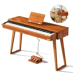 a wooden piano with a laptop on it's stand and an image of a man sitting at a desk