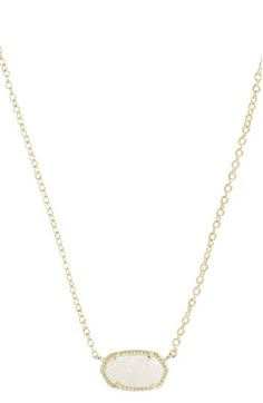 A glittering stone sparkles at the center of a mesmerizing, versatile pendant necklace. 15" length; 2" extender; 3/8"W x 5/8"L pendant Lobster clasp closure Drusy/14k-gold plate or rhodium plate Imported Elisa Pendant Necklace, Kendra Scott Necklace Elisa, Kendra Scott Elisa, Filigree Pendant Necklace, Bday List, Preppy Jewelry, Kendra Scott Necklace, Preppy Stuff, Coin Pendant Necklace