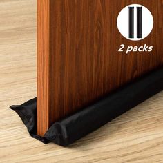 two packs of wood flooring with black liners