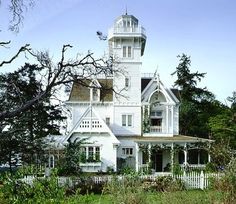 a large white house with a tall tower