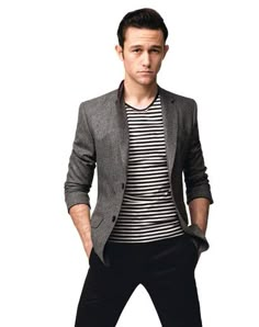 a young man in a striped shirt and blazer is posing for a magazine cover