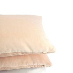 two pillows sitting on top of each other