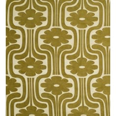 a green and white rug with an abstract design on the front, featuring large flowers