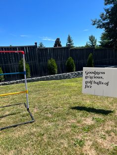 a sign that says goodness is the goal of fire in front of a playground set